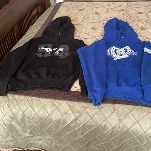 Pair of Murdochs hoodies. Black small blue med
